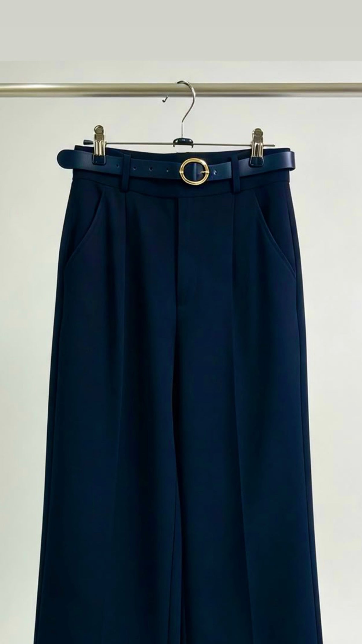 Navy blue belted trousers